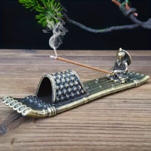incense holder man in boat